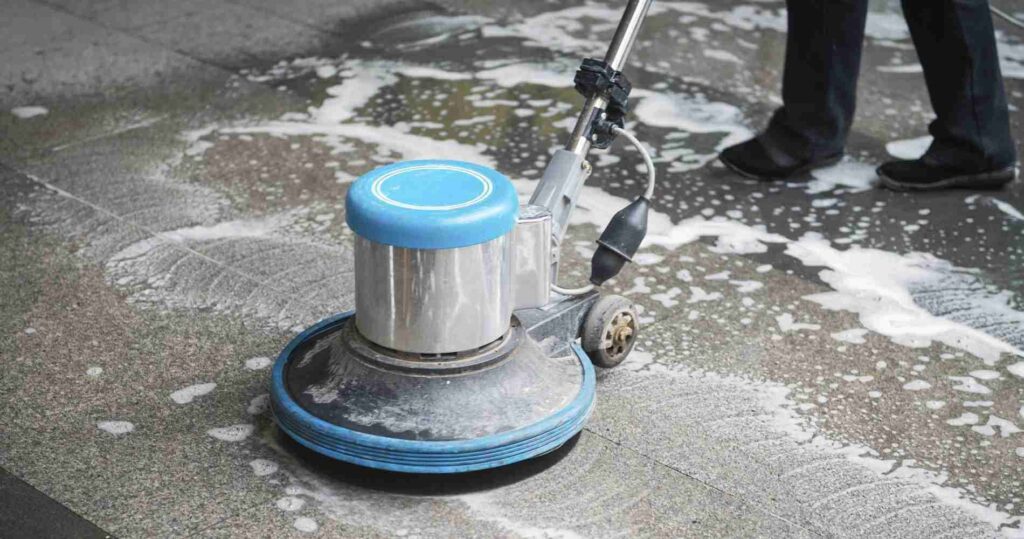 Tile and Grout Cleaning in Maryland: The Complete Guide to Restoring Your Floors 2 Rotary floor machine scrubbing tile with cleaning solution