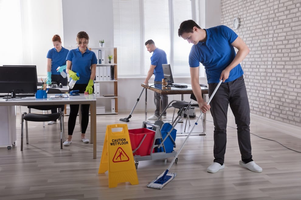 Apartment Building Cleaning Services: The Complete Maryland Guide 2 Commercial cleaning crew mopping and vacuuming an office