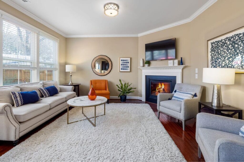 Light-colored area rug in a furnished living room